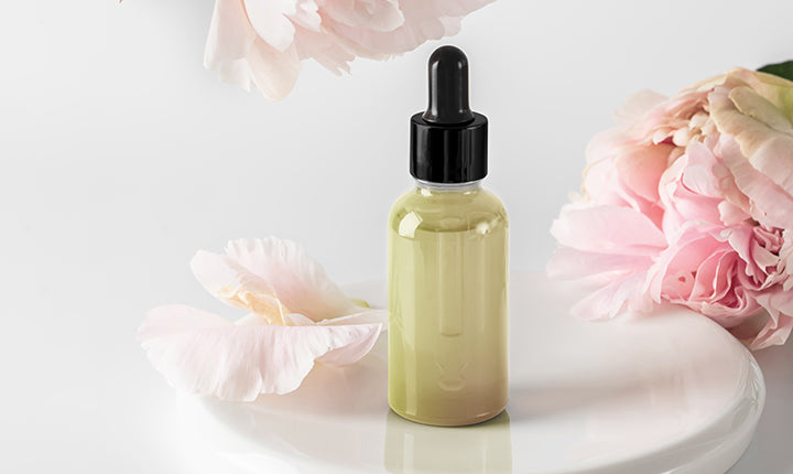 Essential Oil Bottle With Rose Flowers