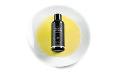 Load image into Gallery viewer, Organic Argan Oil 50ml Violet Glass Bottle on White Plate with Oil
