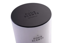 Load image into Gallery viewer, Close Up of Candle Lid Embossed with Four Scents Logo Covering Top of Four Scents Candle
